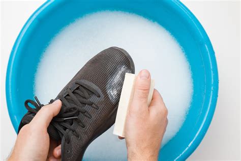 washing running shoes in washer.